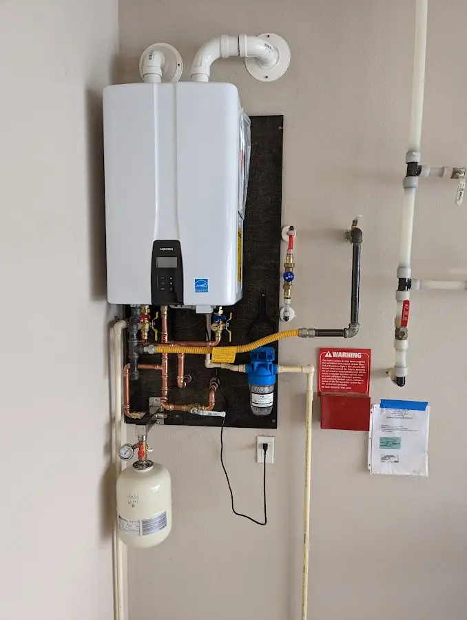 Professional plumber installing copper piping in a South Strabane home